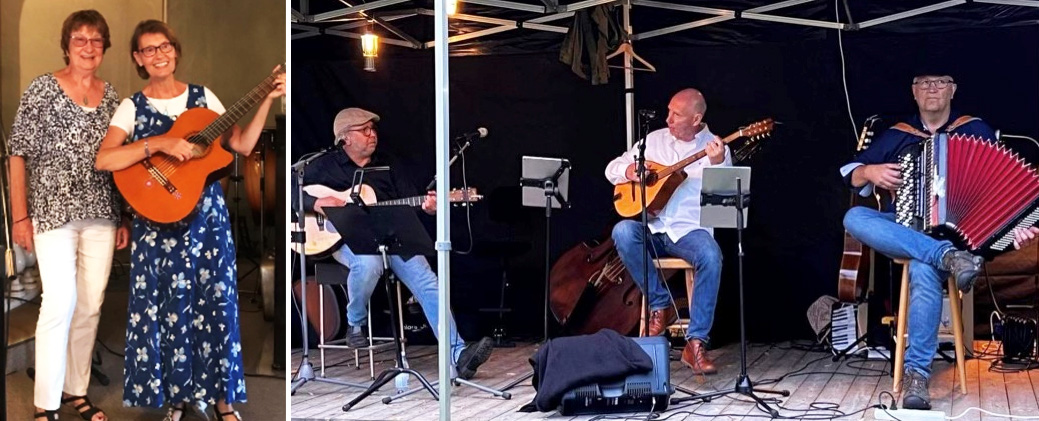 Två sjungande kvinnor, en med gitarr, och tre män med musikinstrument på en scen.